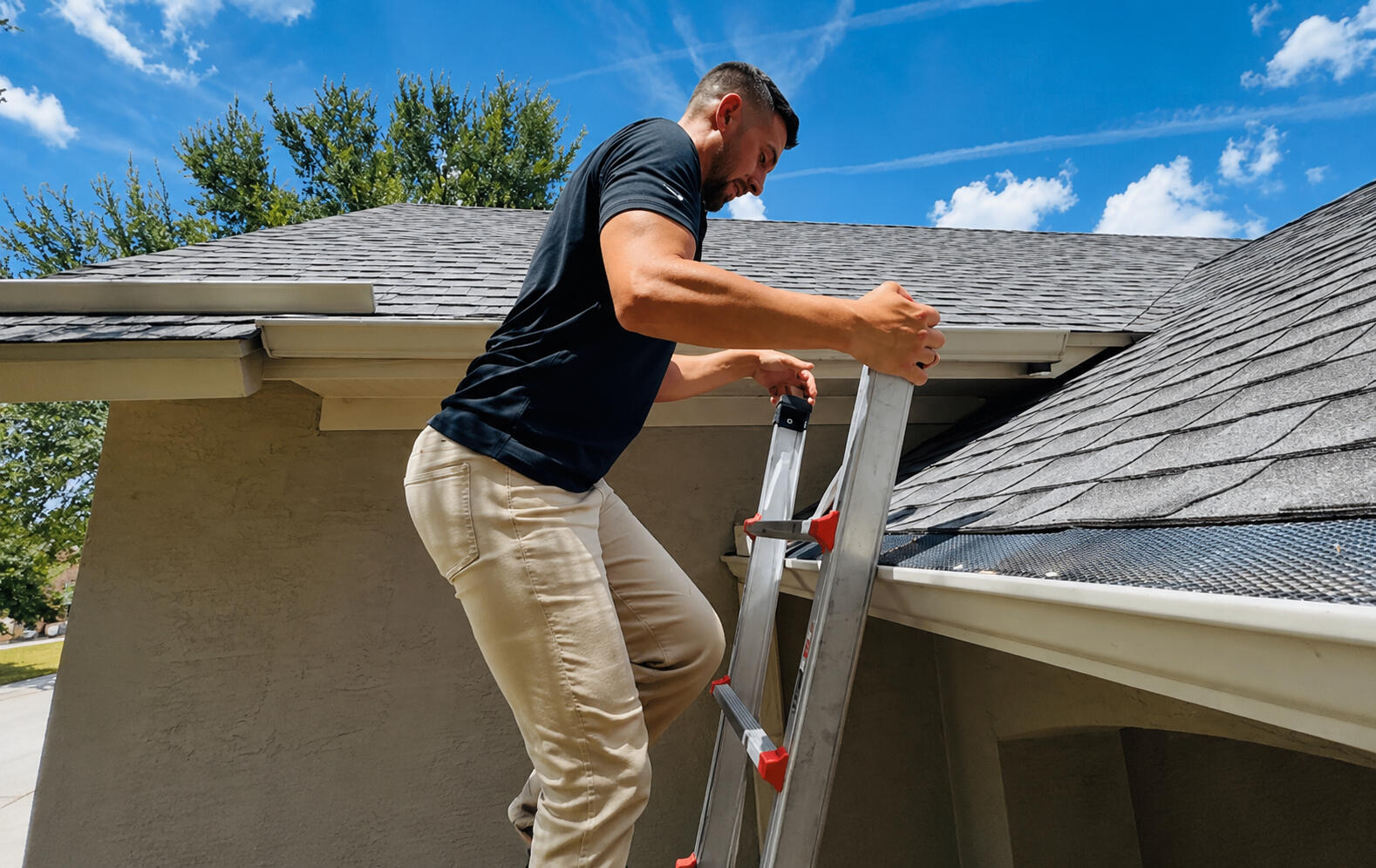 Roof Inspection | American Elite Roofing San Antonio Roofing professional climbing up a ladder to gain access to a residential roof during a roof evaluation in San Antonio, Texas.